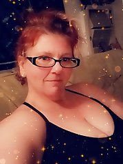 A collection of images featuring a voluptuous redhead with a curvy posterior