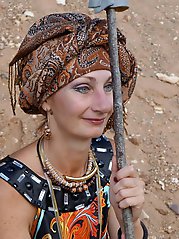 With spear wearing in colorful dress