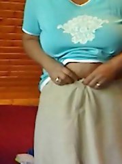 Fiery older woman is fingering her holes