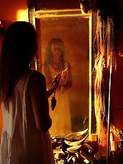 An amazing old lady is posing almost naked in stunning shots