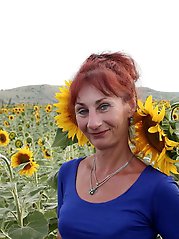 Aged girlfriend is posing undressed on the street