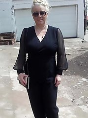 Lascivious mature businesswomen in a sex gallery