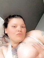 The woman is posing naked for a photo session