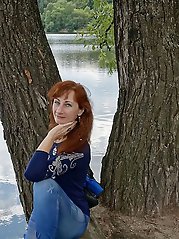 A beautiful mature woman is fondling her genital area